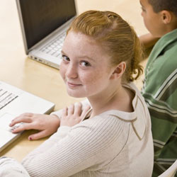 girl and boy working on laptop computers