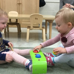 two babies playing