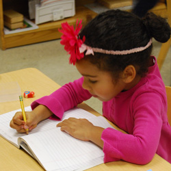 girl writing in notebook